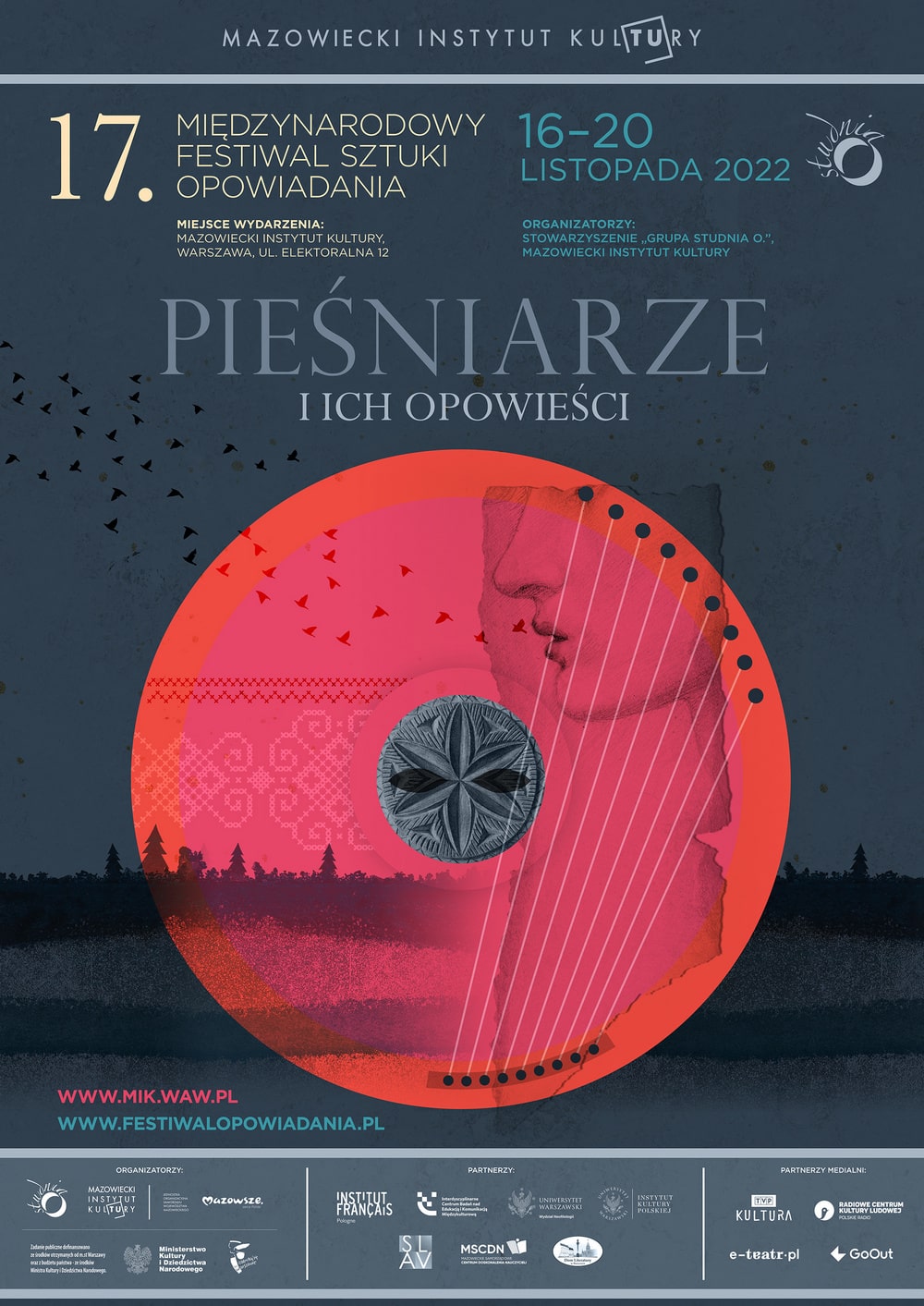 grafika: na ciemny tle czerwone koło, wewnątrz koła widoczne rysunki fragmentu profilu kobiecej twarzy, strun harfy, drzew w oddali