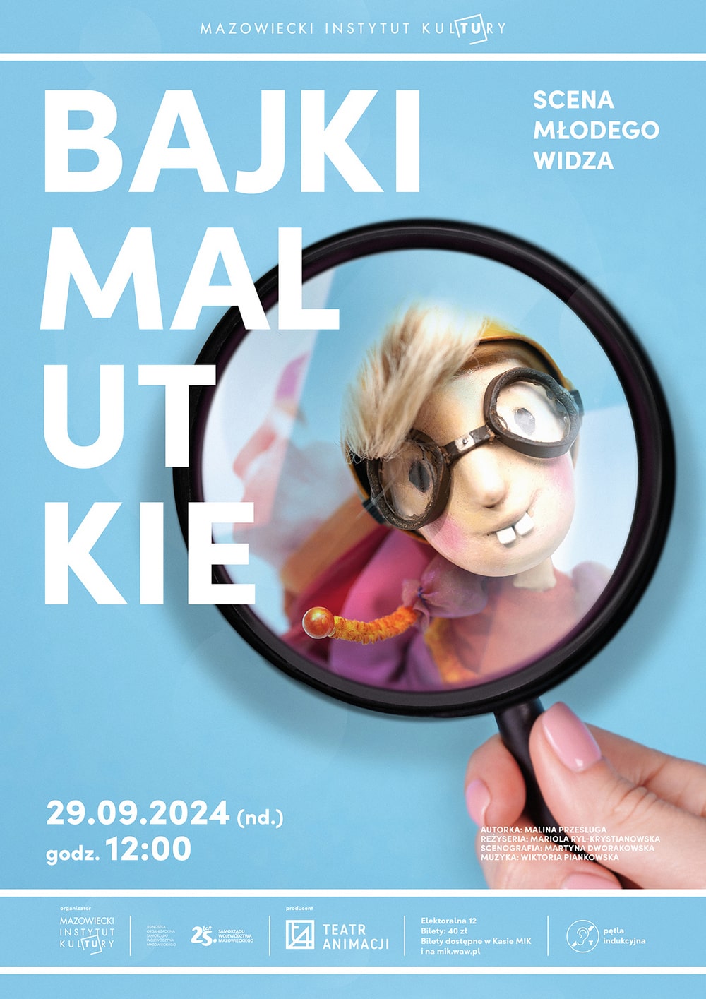grafika reklamowa na jasno niebieskim tle szkło powiększające w którym widać głowę lalki scenicznej